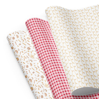 Three sheets of pasta-themed wrapping paper with pasta illustrations and gingham.