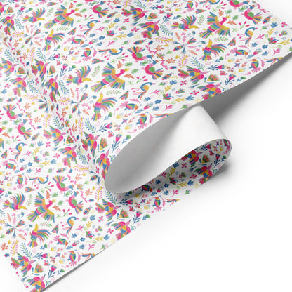 A sheet of colorful wrapping paper featuring Mexican-inspired Otomi illustrations.