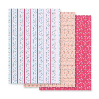 blue and pink wrapping paper with flower illustrations.
